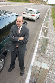 Angry man at car accident scene uid 1342122